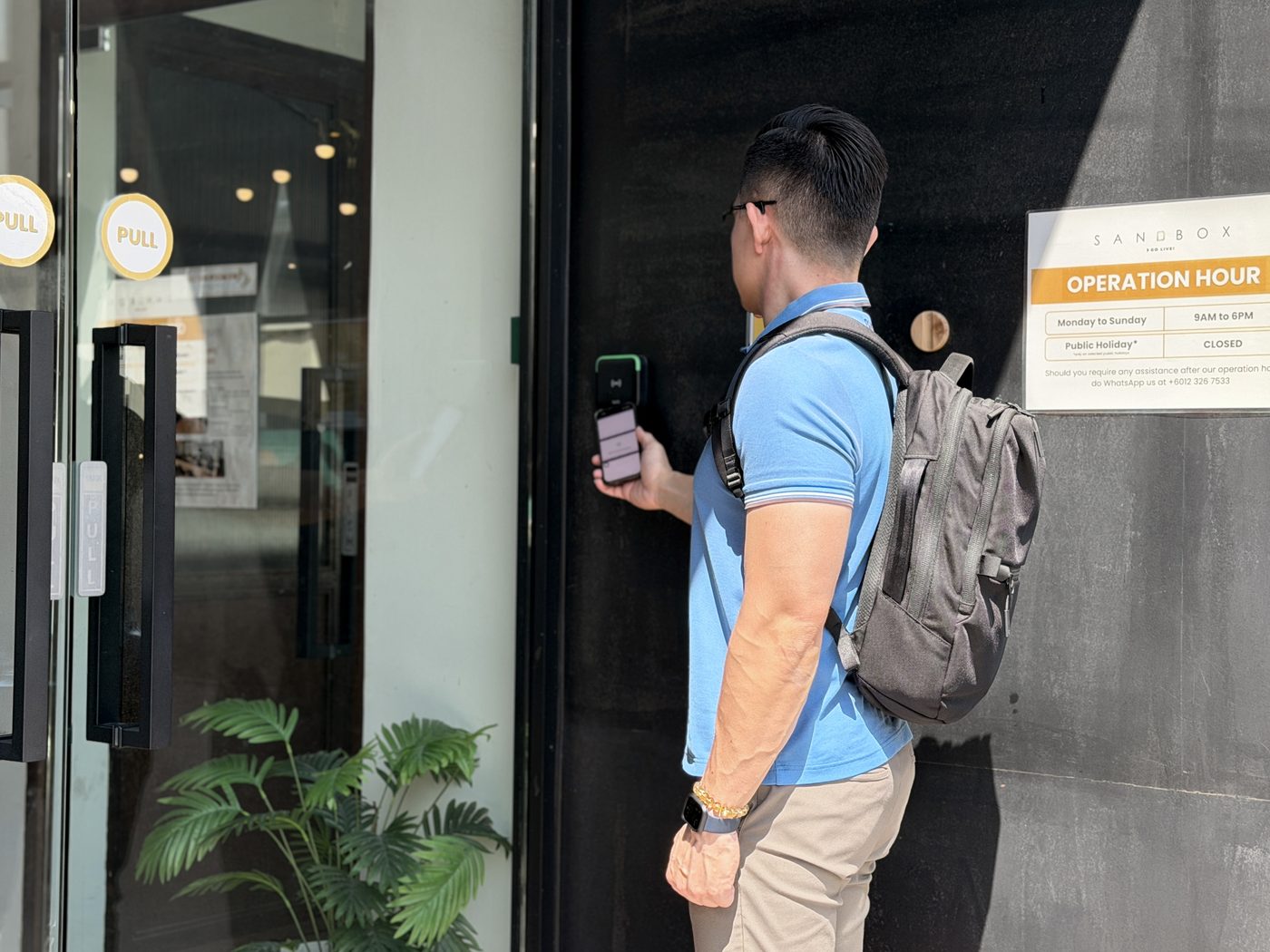 Member arriving at Sandbox Space coworking with app entry