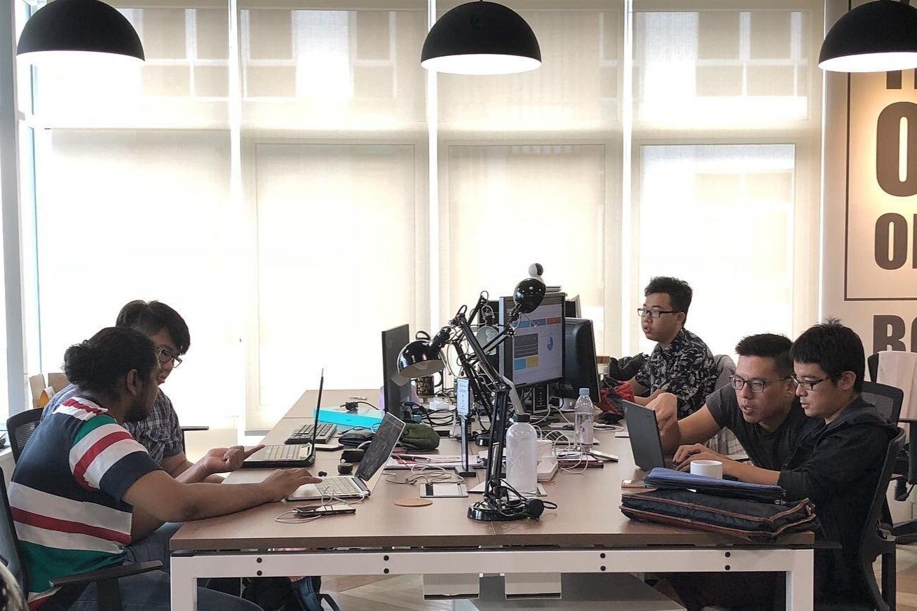 Startup team working from dedicated desks at Sandbox Space coworking