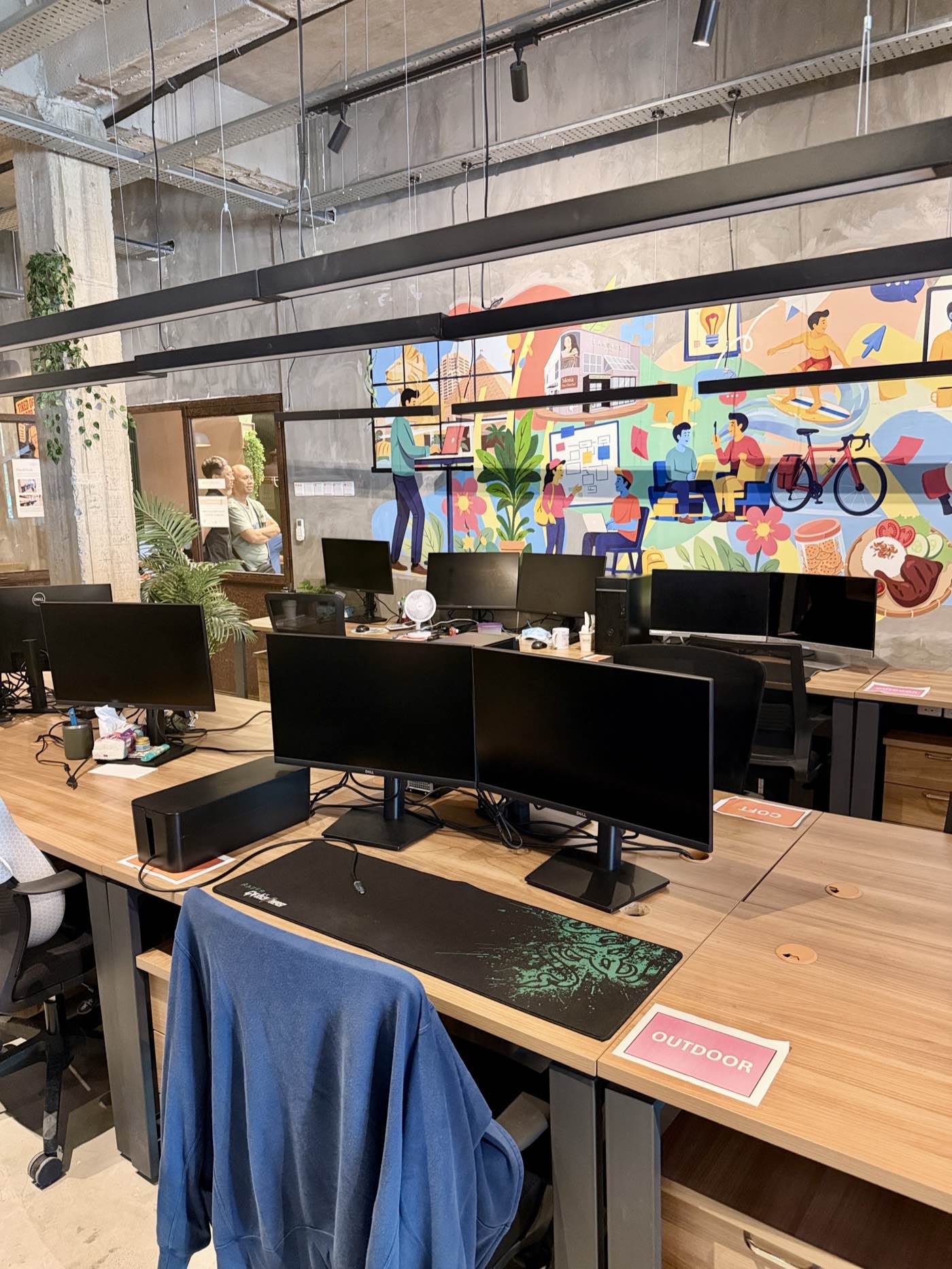 Dual-monitor dedicated desk setups left ready overnight at Sandbox Space Bandar Sunway