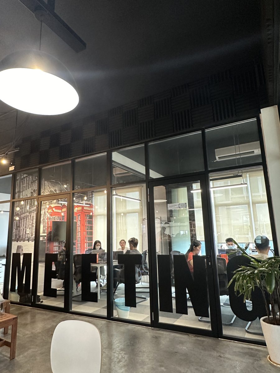 Client meeting behind the glass MEETING wall at Sandbox Space Sri Petaling