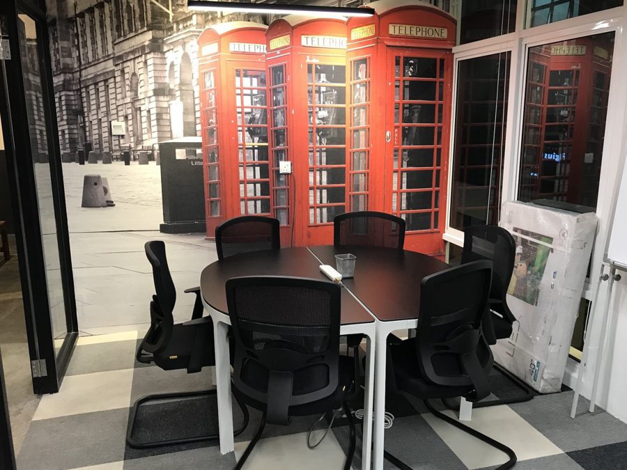 Small meeting room for rent in Sri Petaling KL, 6 pax with red phone box mural