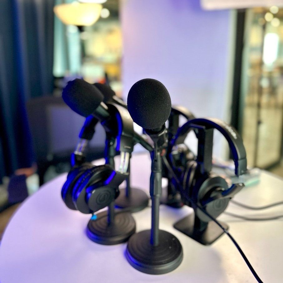 Audio Technica microphones and monitor headphones in the Sandbox podcast studio