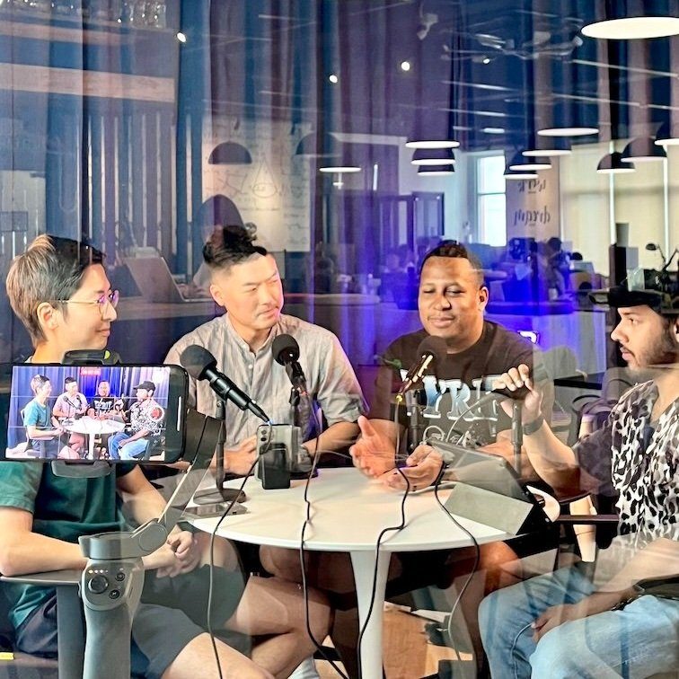 Four hosts recording a podcast at the Sandbox Space studio in Sri Petaling